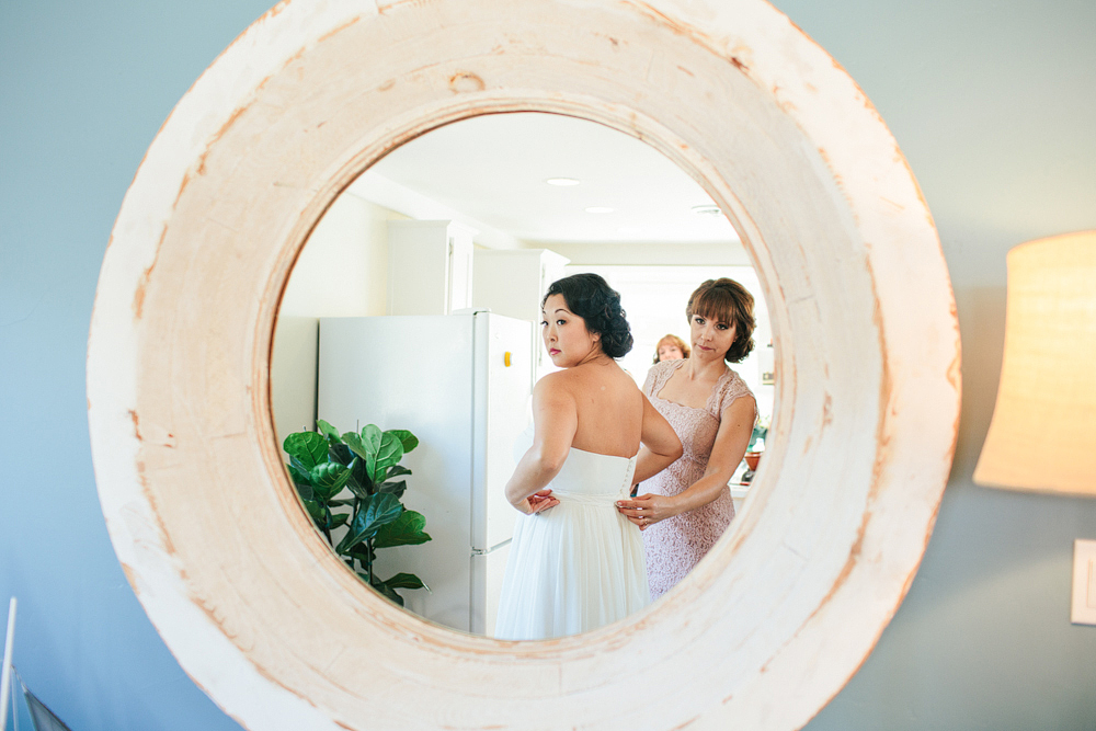 This is a photo of Helen putting on her dress.