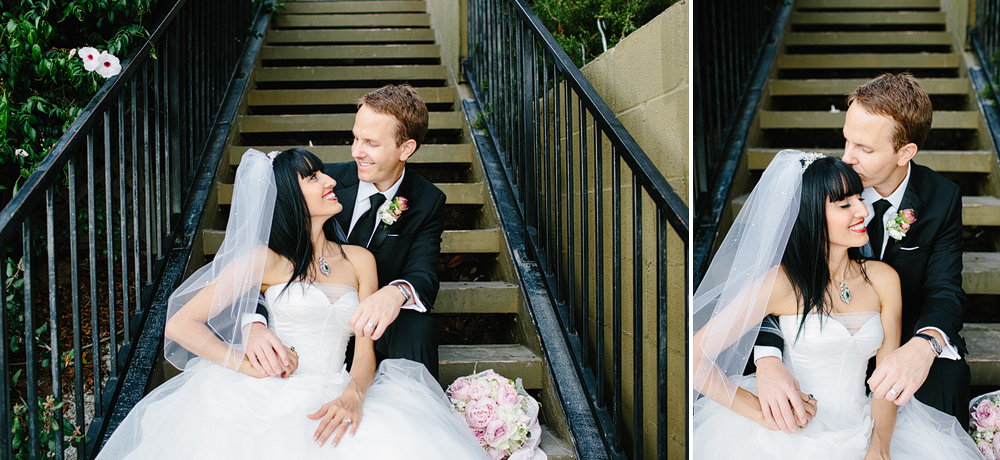 The bride and the groom on the stairs.