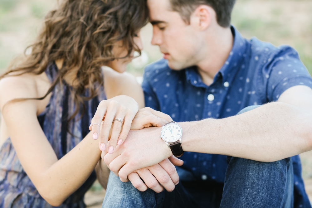 A photo of Jordan and Riley showing off her engagement ring. 