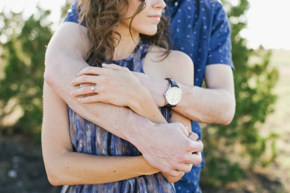 The couple hugging at their engagement session. 