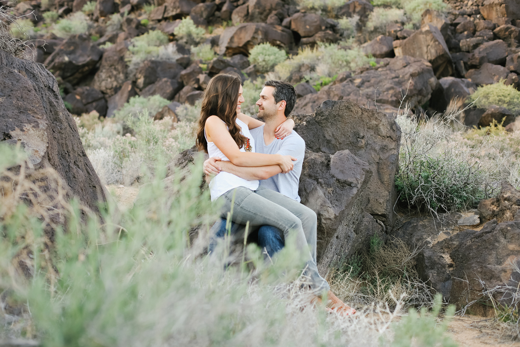 Now they are sitting on the volcano rocks.