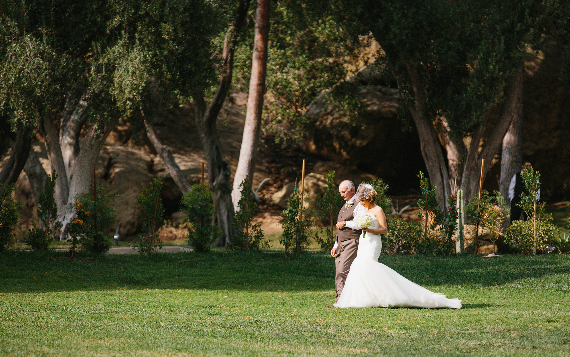 The bride and her dad walking down the aisle. 