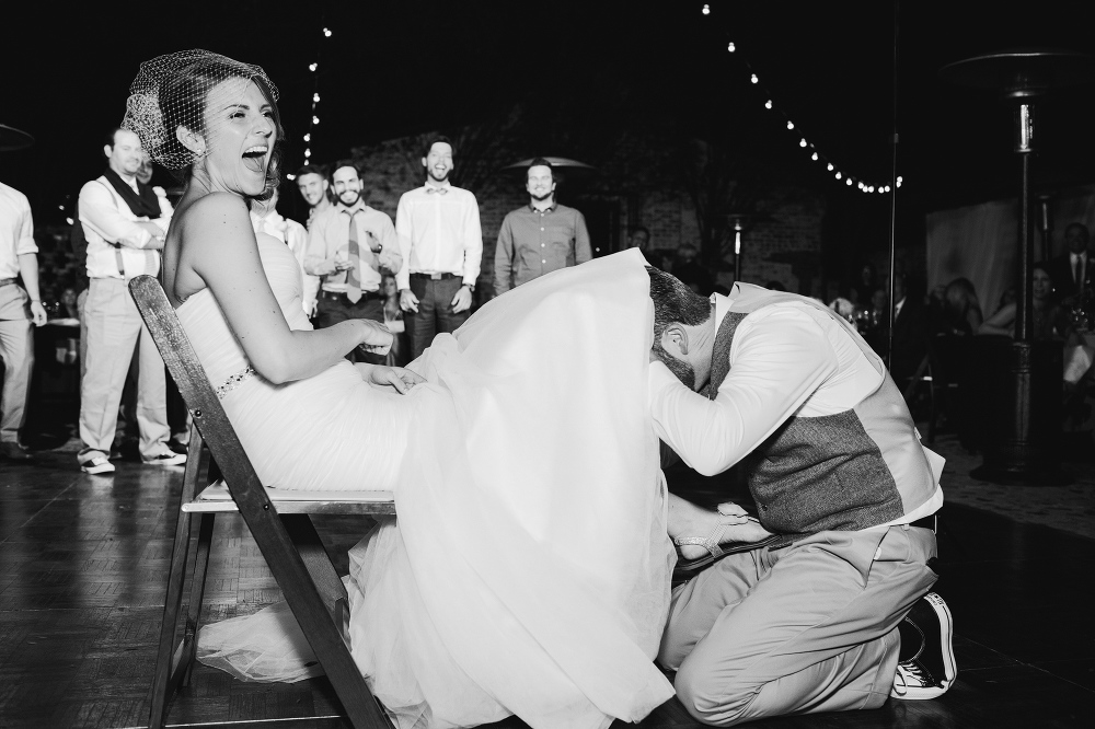 Here is a photo of the groom removing the garter. 