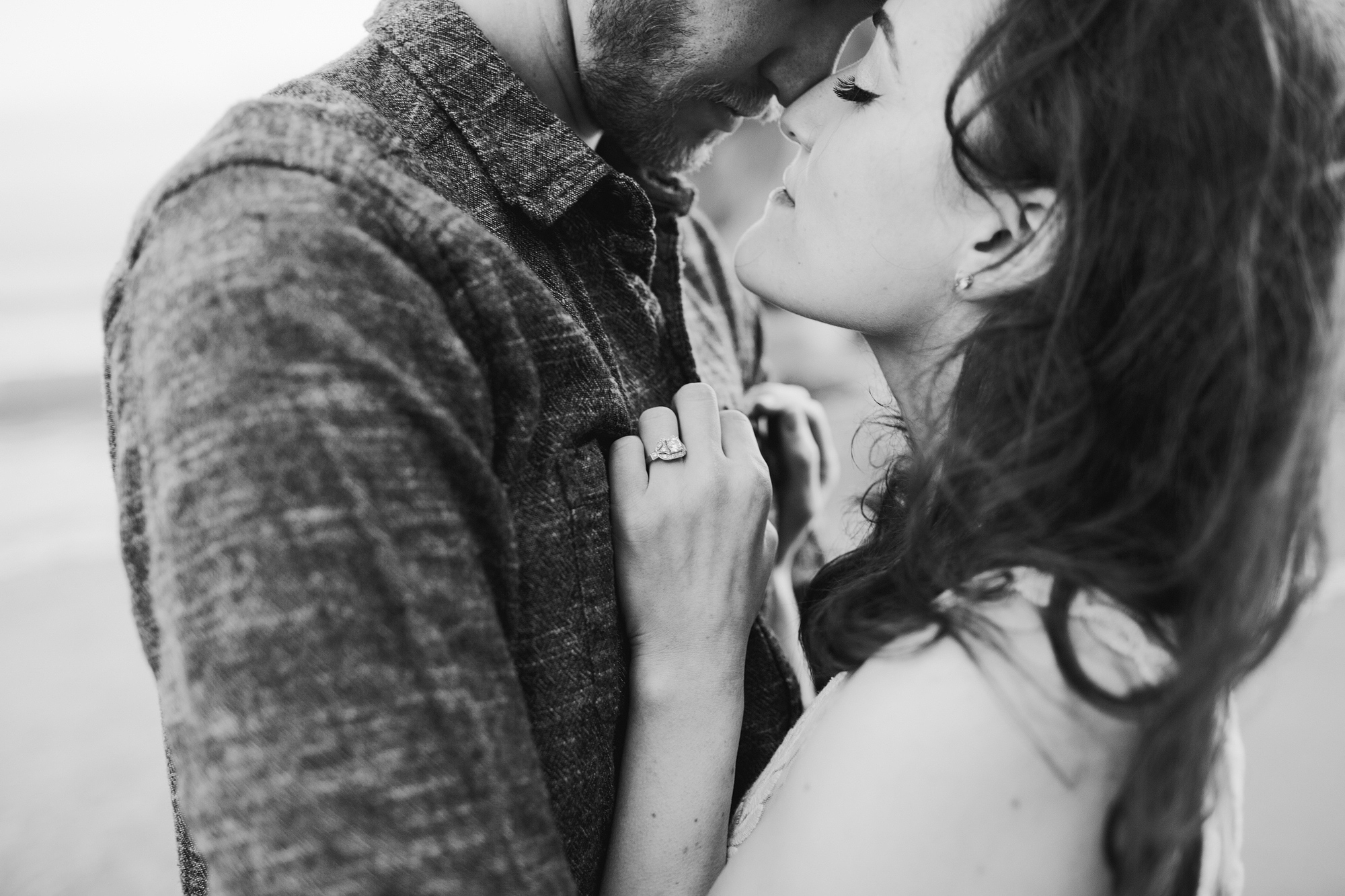 This is a romantic black and white photo of the couple. 