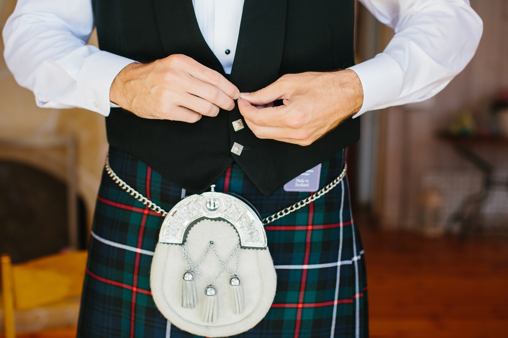 The groom wore a kilt. 