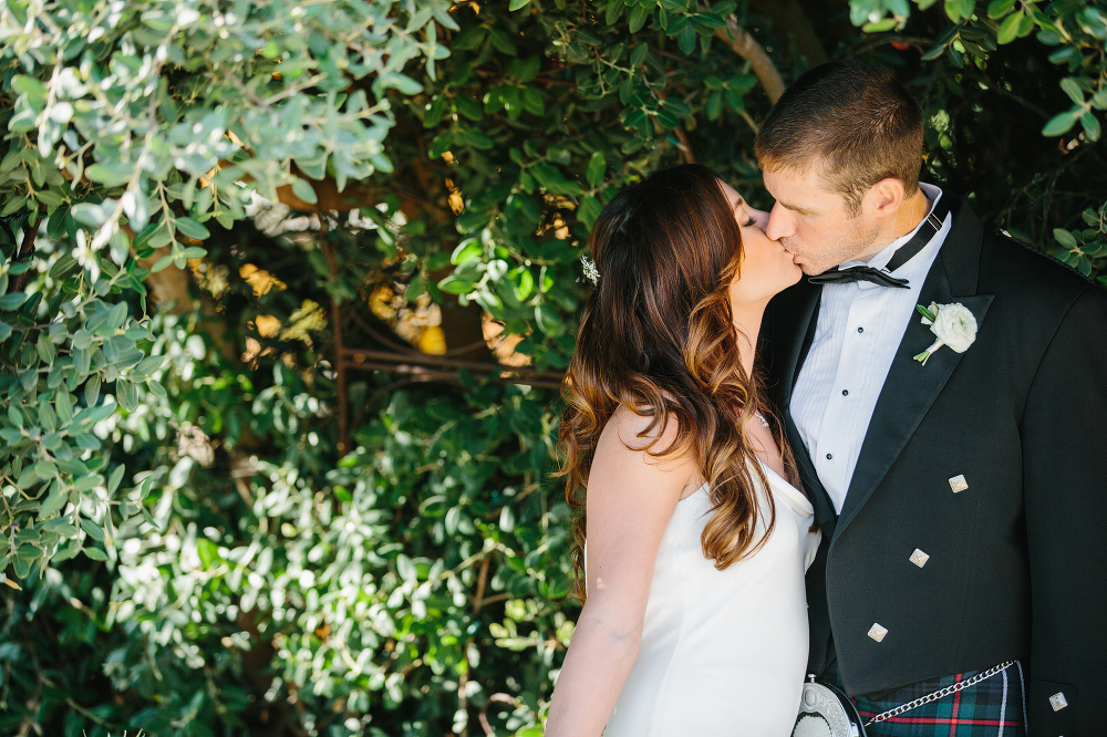 A photo of the bride and groom surrounded by trees. 