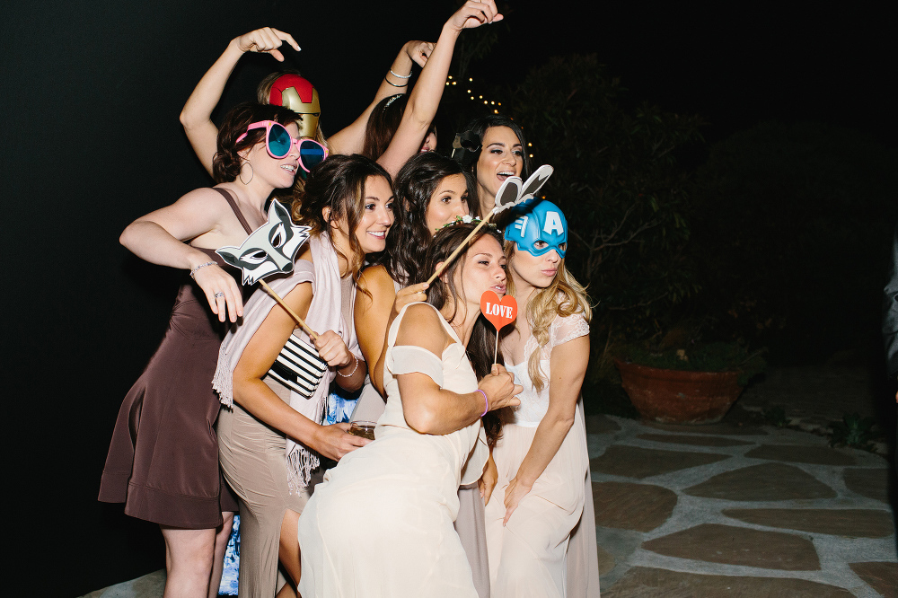 The bridal party and guests using the Photo Booth. 