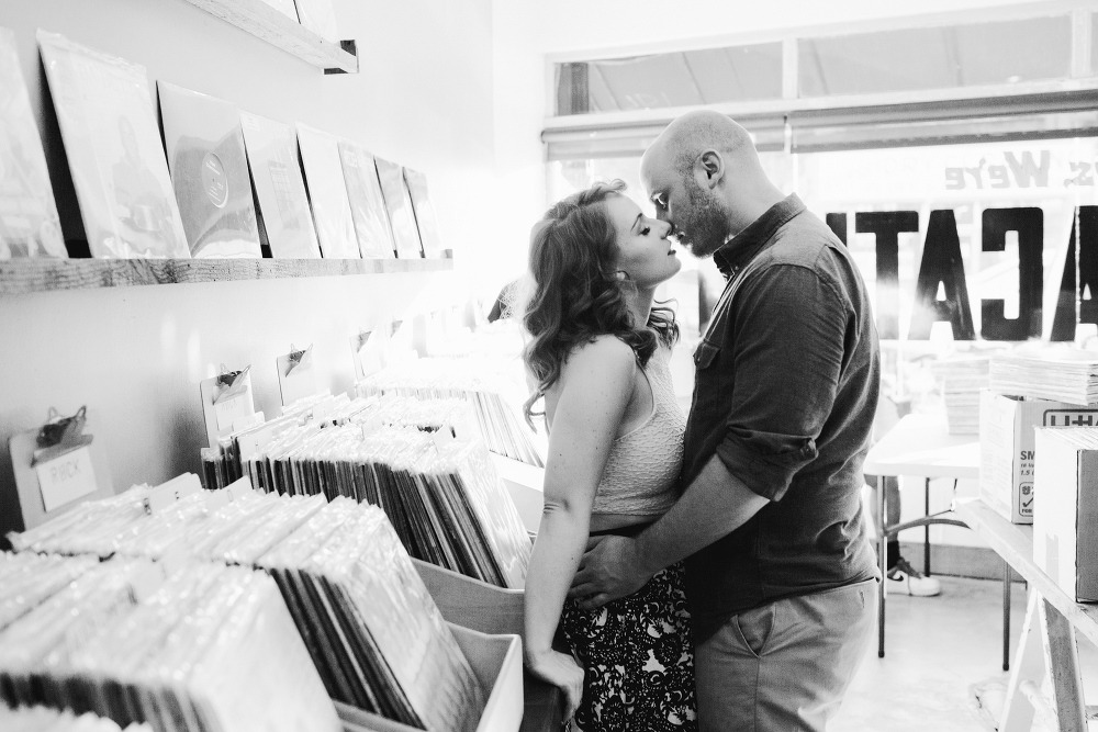 A black and white photo in the record store. 