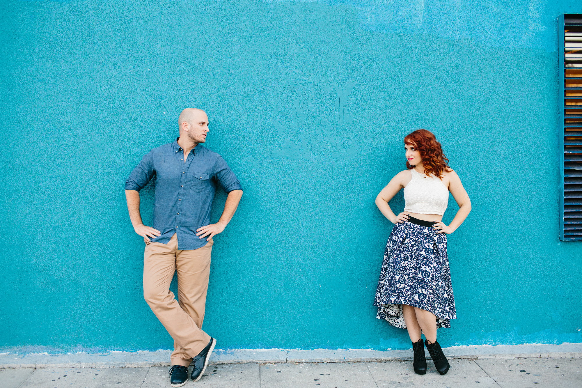 Afton and Jesse in front of a blue wall. 