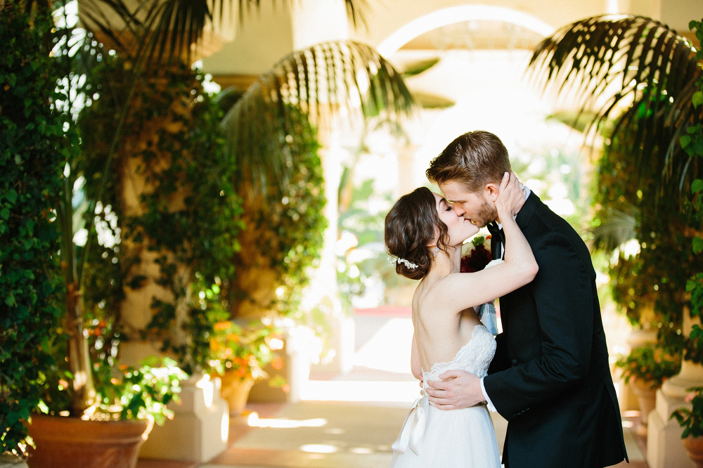 A sweet kiss between the bride and groom. 