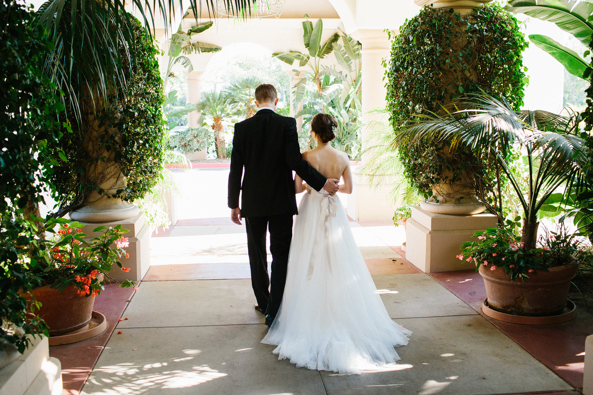 The bride and groom walking together. 