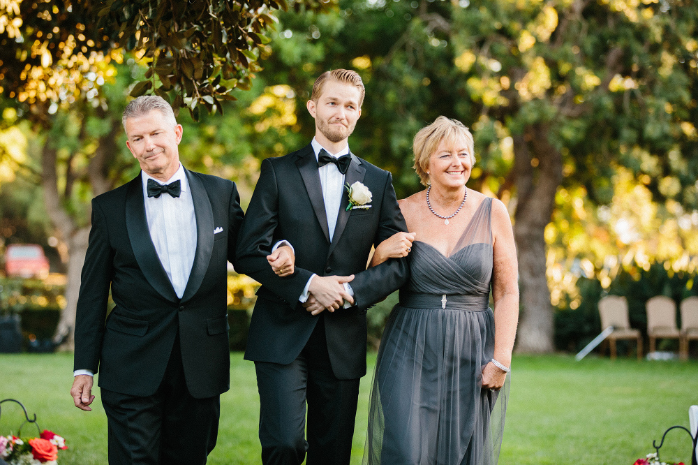 Karl walking down the aisle with his parents. 