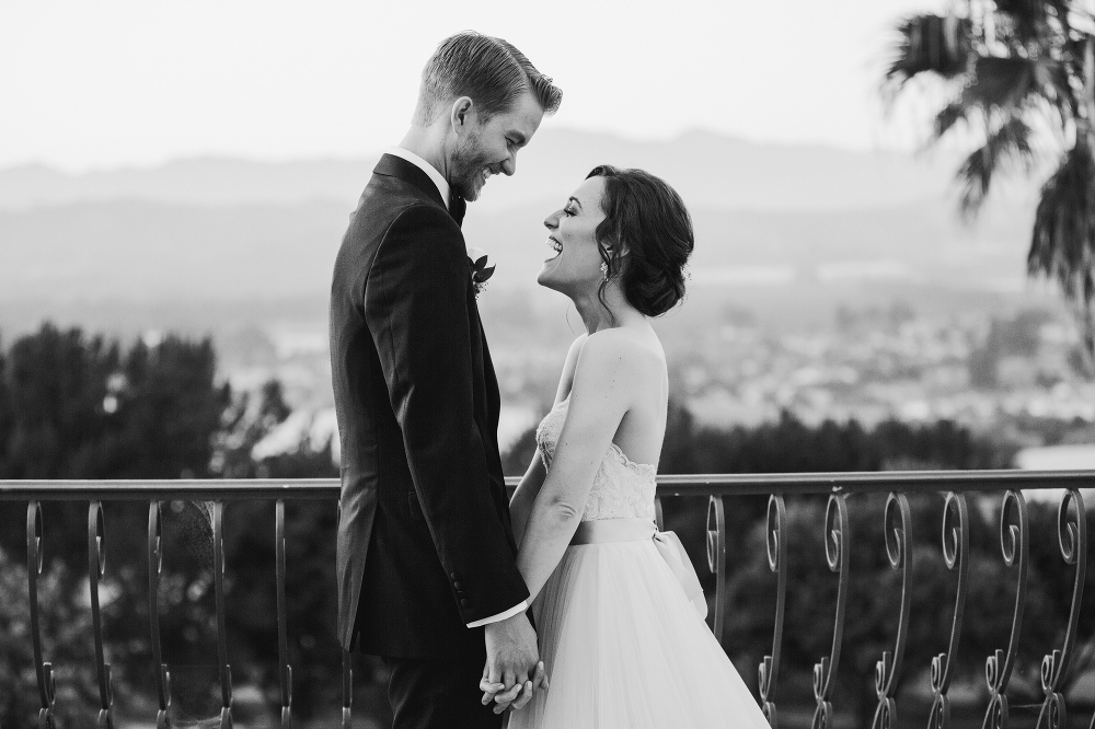 A black and white photo of Laura and Karl laughing. 