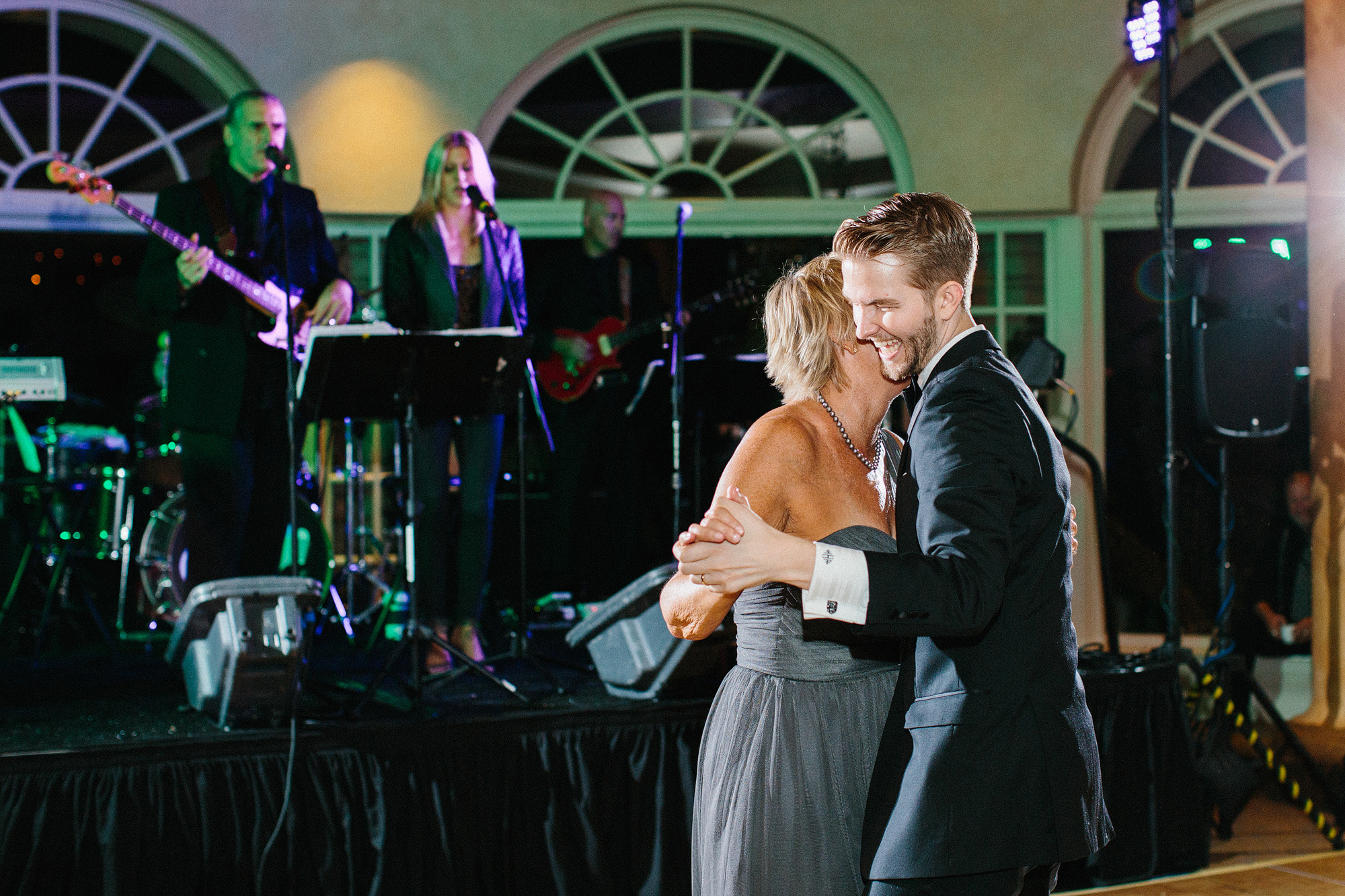 The groom having a special dance with his mom. 