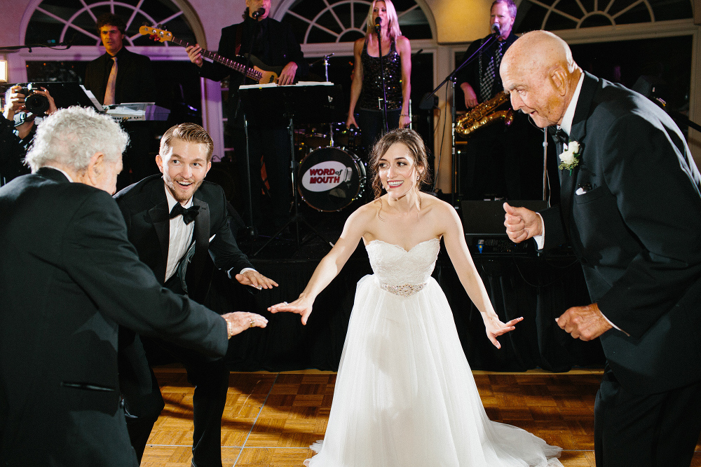 The bride and groom dancing with their guests. 