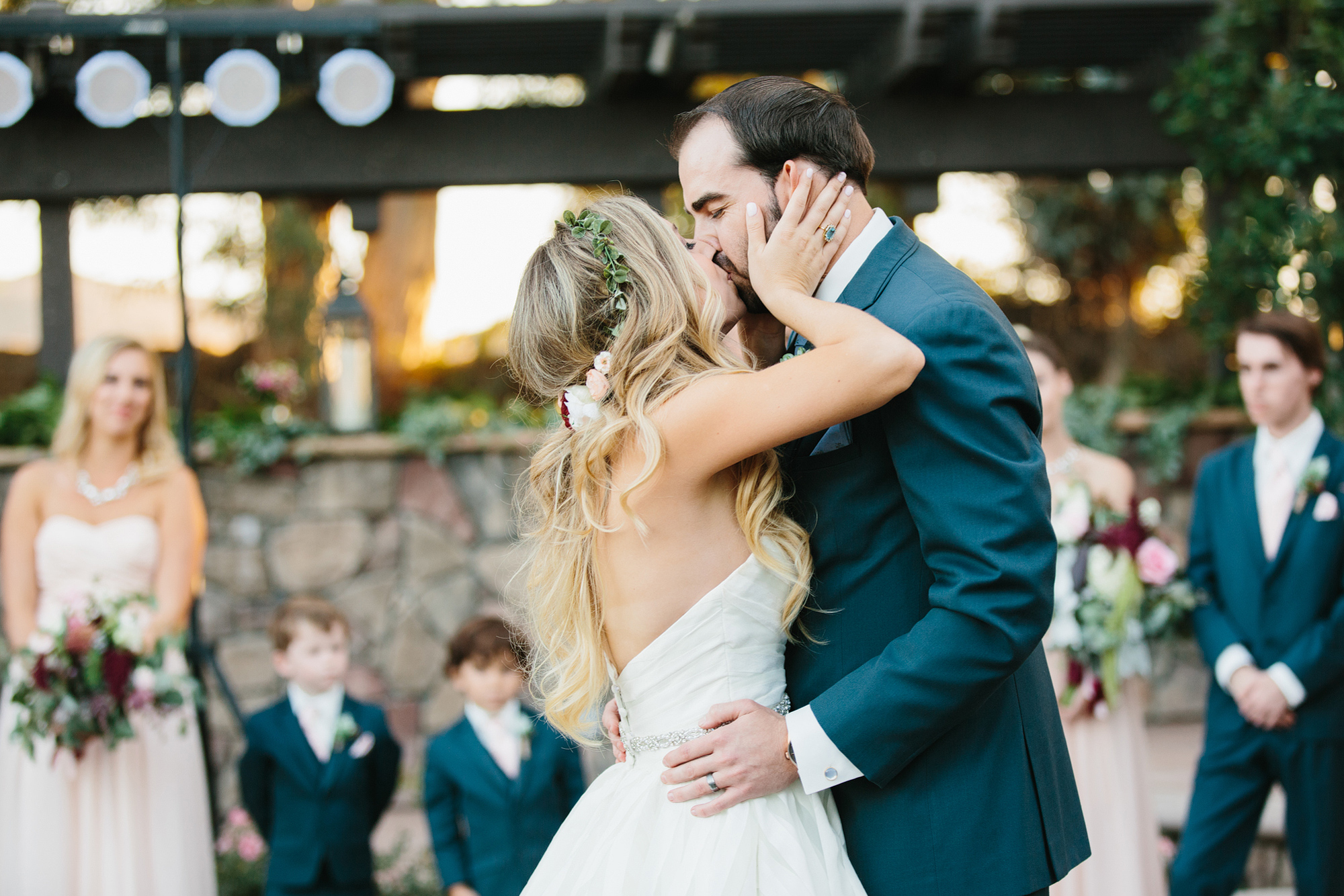 Katie and Chad kissing during their first dance. 