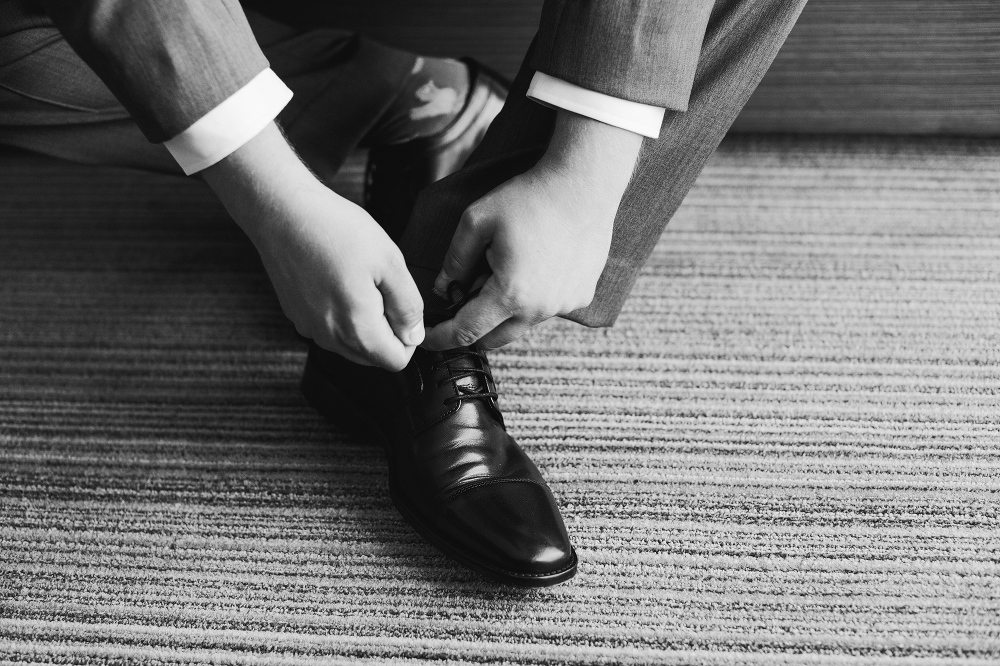 Steven putting on his shoes. 