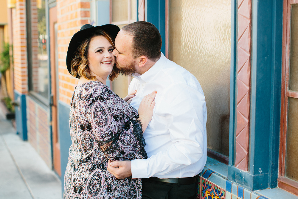 Jason giving Amanda a kiss on the cheek. 