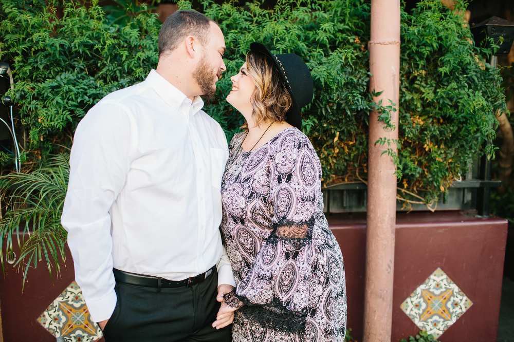 A cute photo of Amanda and Jason in front of a planter. 