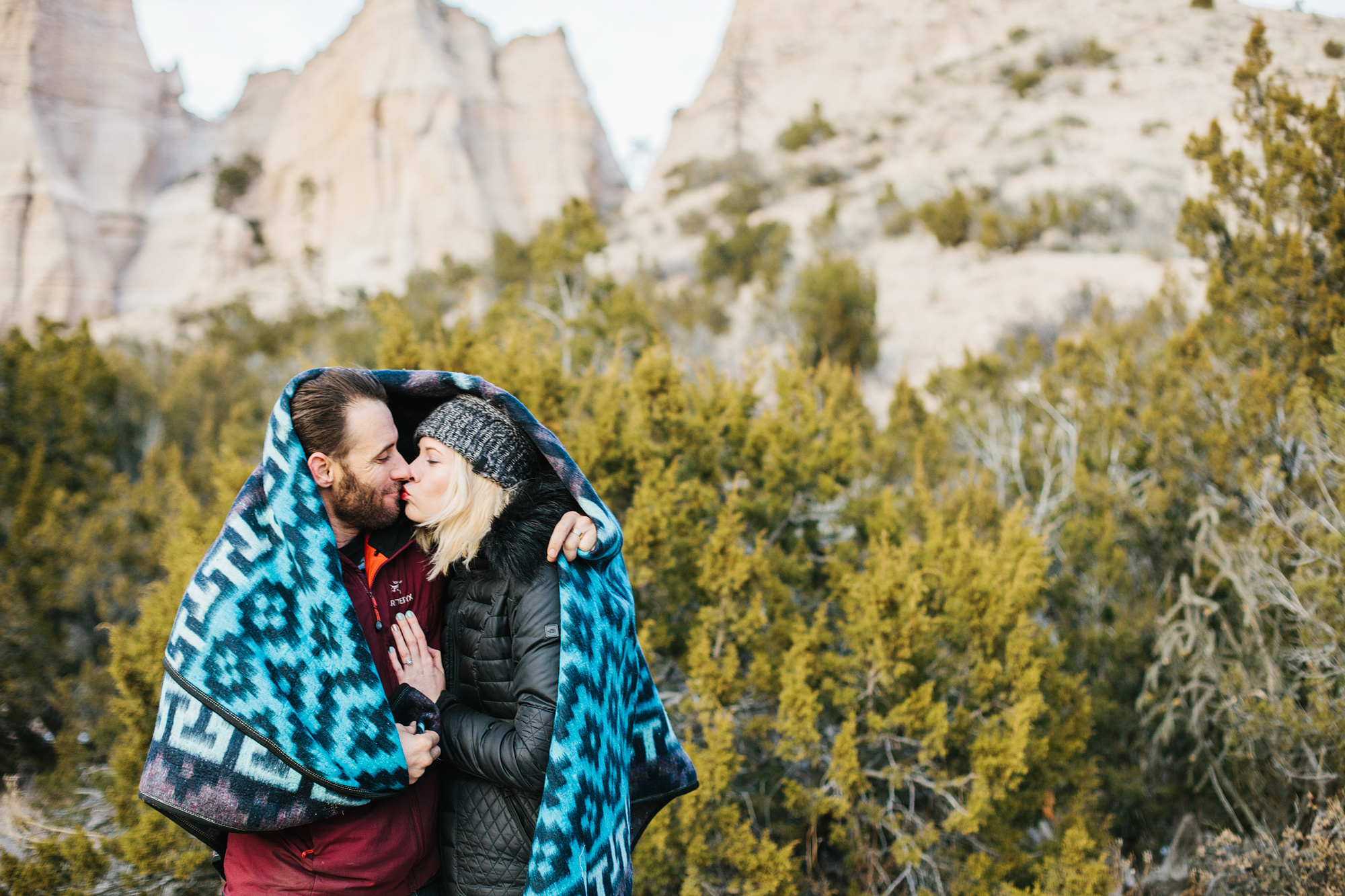 An adorable photo of the couple kissing. 