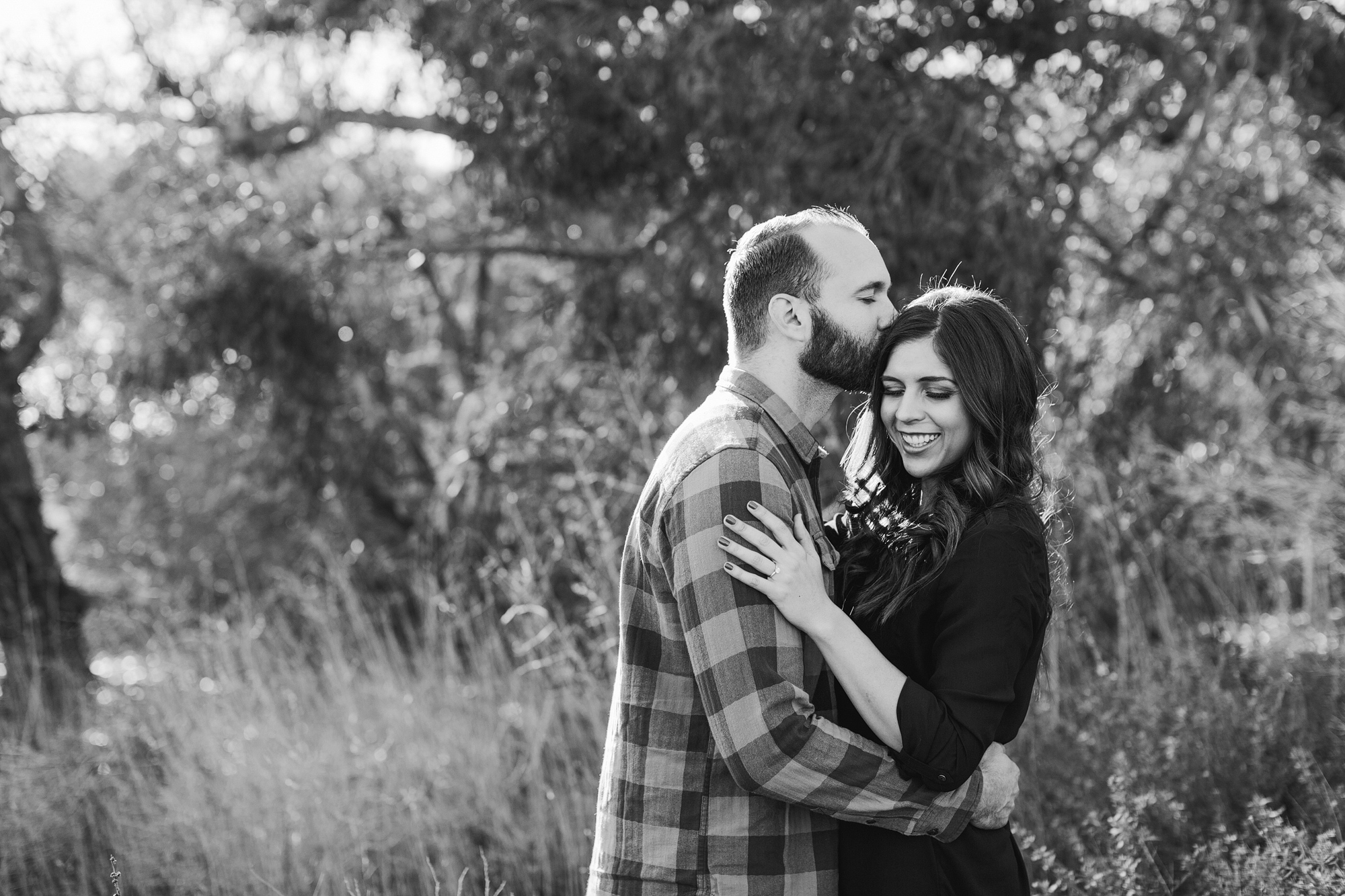 A black and white portrait of the engaged couple. 