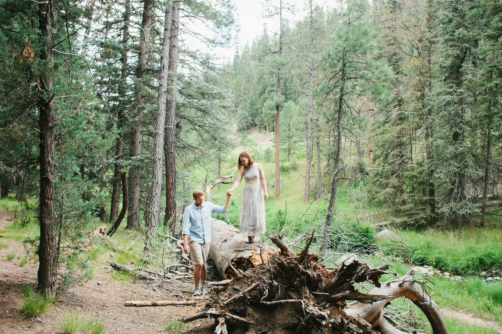 Madie walking on the fallen tree. 