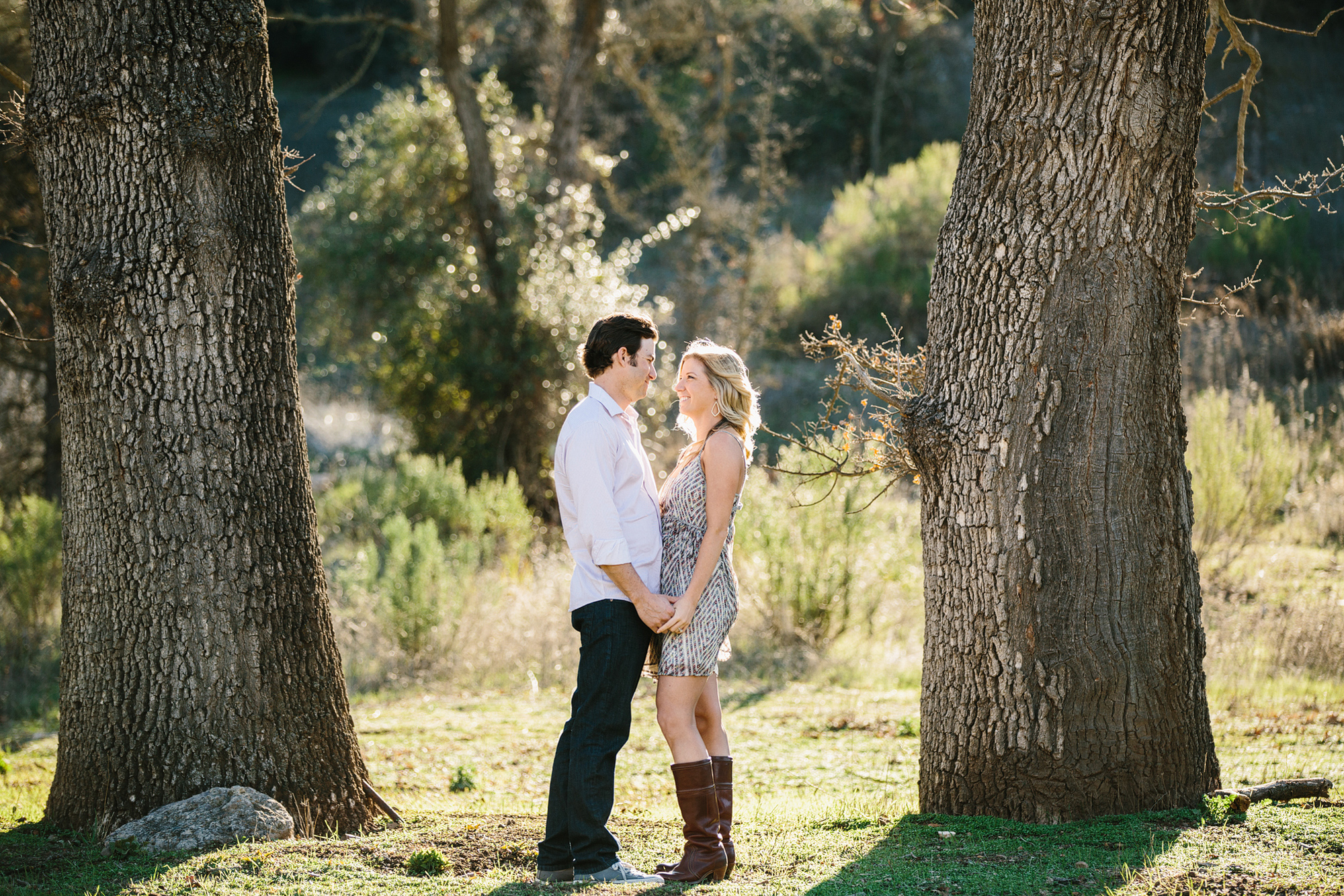 The couple between two tall trees. 